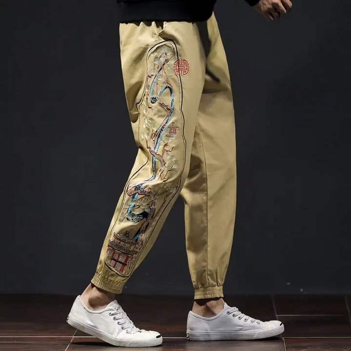 Comfortable men's joggers with unique embroidered bonsai design, ideal for casual, athletic or streetwear.