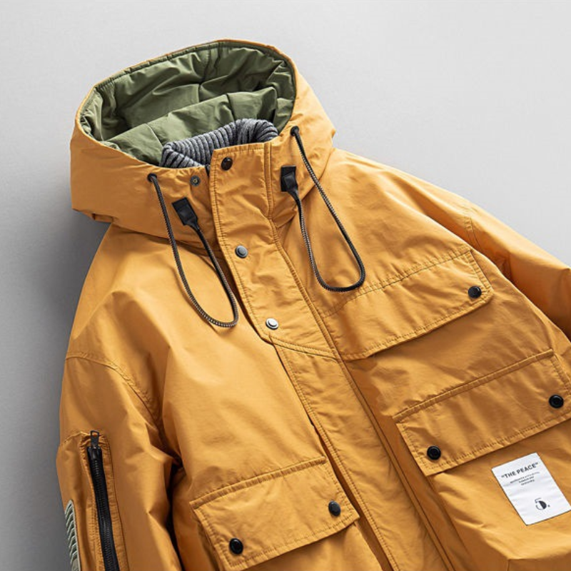 Close-up of durable, waterproof fabric on men's Equinox winter parka. Warm jacket, utility outerwear.