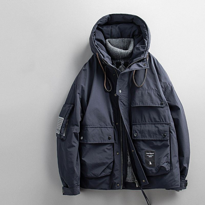 Men's Equinox parka with faux fur-lined hood, offering extra warmth & wind protection for winter.