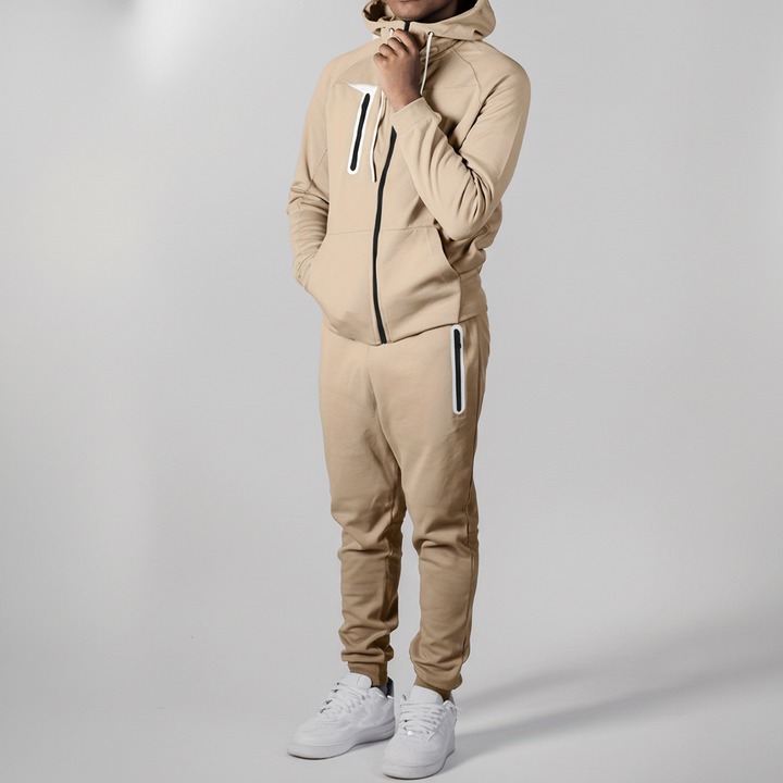 Side view of model wearing men's Eric zip-up hoodie and pants, suitable for loungewear