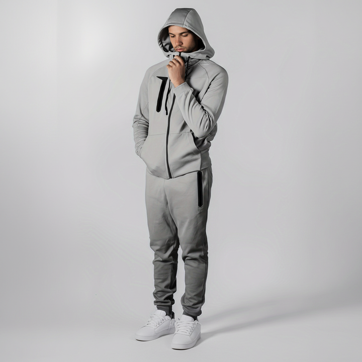 Detail of the zipper and pockets on the men's Eric zip-up hoodie, part of a casual tracksuit