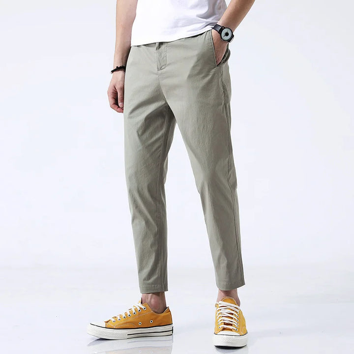 Straight fit men's ankle-length chinos in breathable cotton. Versatile khaki pants for casual & semi-formal looks.