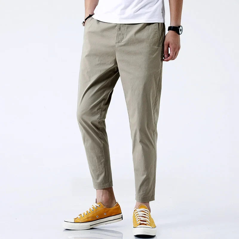 Classic khaki men's straight fit chinos, comfortable cotton pants. Essential ankle-length trousers for any casual occasion.
