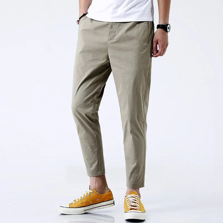 Classic khaki men's straight fit chinos, comfortable cotton pants. Essential ankle-length trousers for any casual occasion.