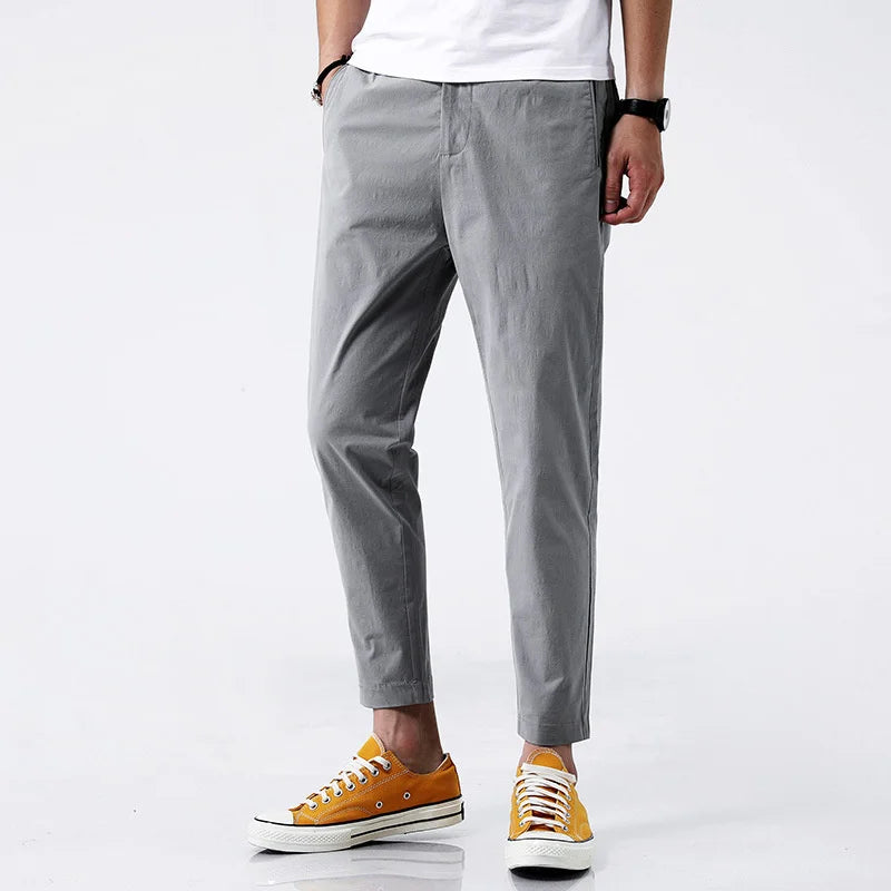 Modern men's straight fit chinos, ankle-length cotton pants. Casual yet stylish, perfect for everyday or semi-formal outfits.