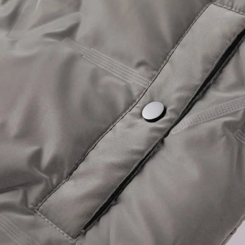 Man wearing Men's Everest Puffer Jacket. Comfortable, warm outerwear for cold weather outdoor activities.
