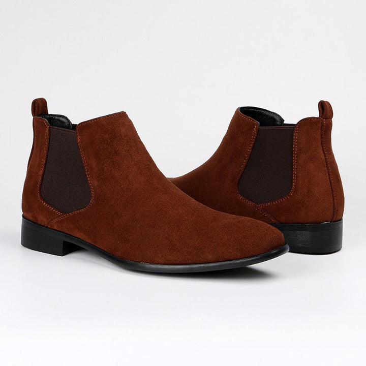 Durable brown men's Chelsea work boots, providing comfort & confident style for daily tasks.