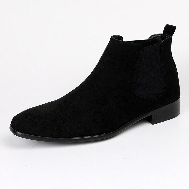 Confident men's brown Chelsea boots, durable, comfortable, & stylish for everyday casual or work.