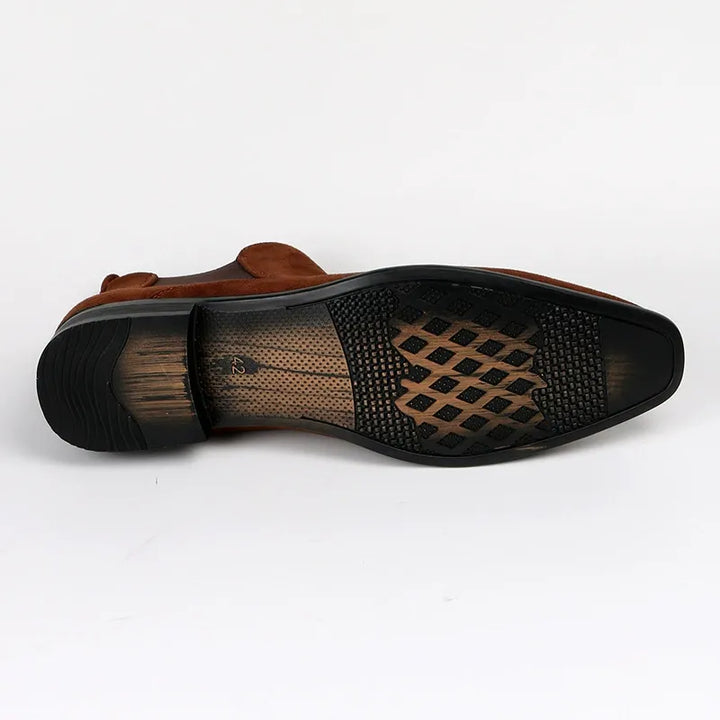 Close-up of durable black men's Chelsea boots, highlighting quality construction & everyday comfort.
