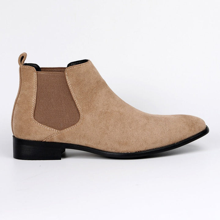 Men's stylish brown Chelsea boots on feet, demonstrating everyday comfort & confident appeal.