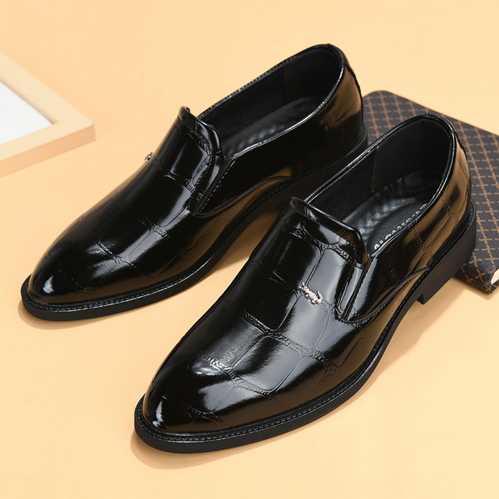 Classic men's black leather slip-on loafers for formal business attire & comfort.