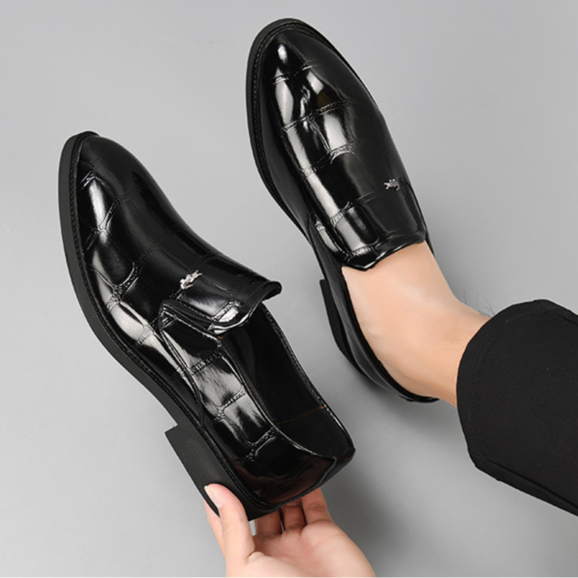 Stylish men's slip-on dress shoes, black, perfect for business casual and executive looks.