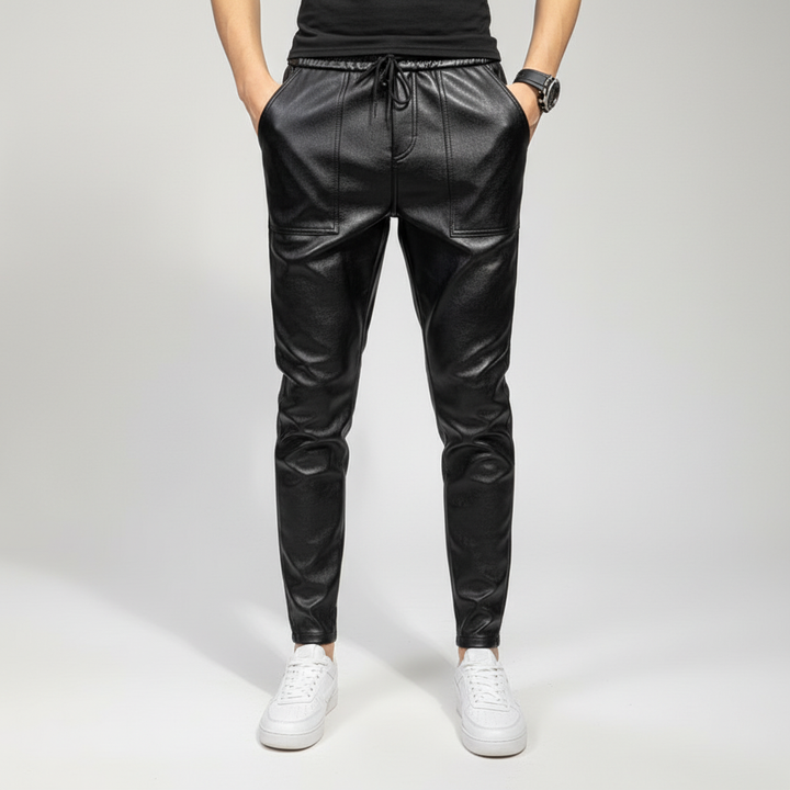 Stylish slim-fit men's faux leather pants, offering versatility for modern outfits.