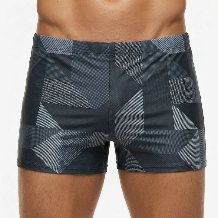 Men's performance swim boxer shorts in blue, providing comfort and support for long hours of swimming or surfing.