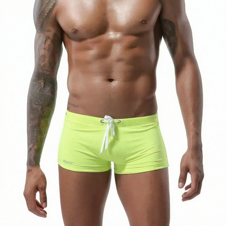 Fitted low-rise mens swim trunks, quick-dry and durable for all active summer needs.