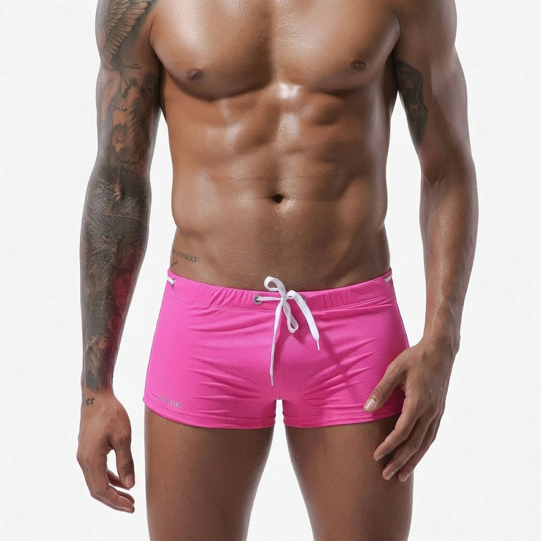 Quick-dry textured dot mens fitted low-rise swim trunks for active swimwear.