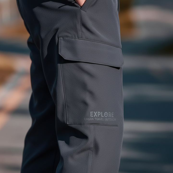 Close-up of men's waterproof cargo pants showcasing fabric texture, secure pockets, and warm fleece interior