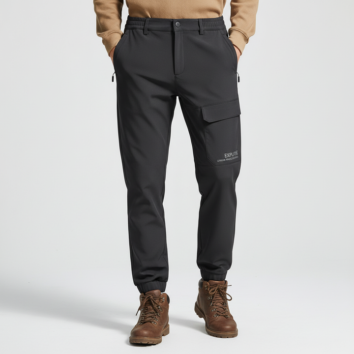 Outdoor shot of men's cold weather cargo pants, perfect for hiking, camping, and other winter sports