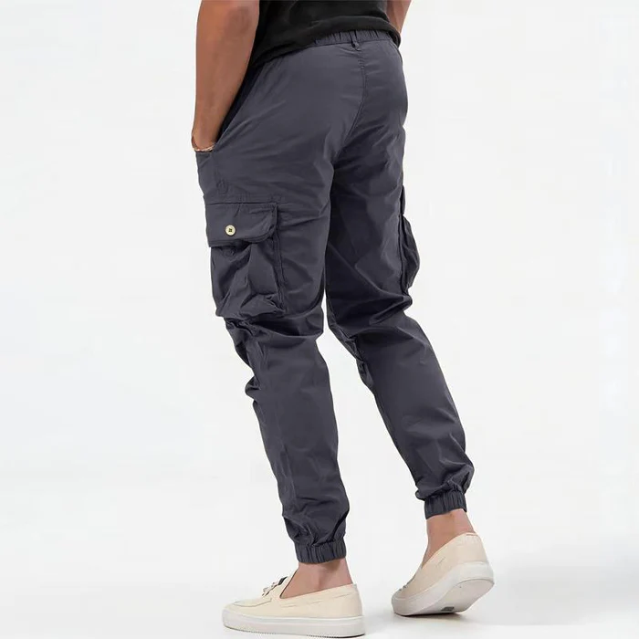 Stylish men's cargo joggers with multiple pockets, perfect for athletic activities or relaxed casual outfits.