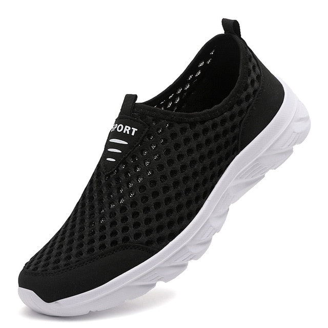 Man wearing lace-free FlexAir Mesh slip-on orthopedic sneakers for healthy, comfortable daily walking.