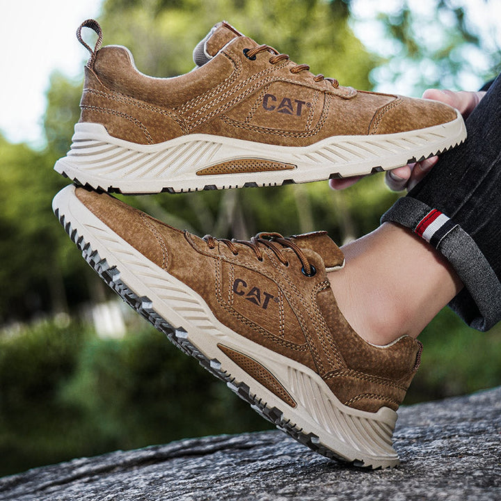 Close-up of Gray Men's Forge sneakers texture, emphasizing durable materials & comfort.
