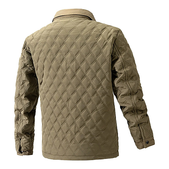 Lightweight men's utility jacket, quilted for warmth, with snap closure and functional chest pockets.