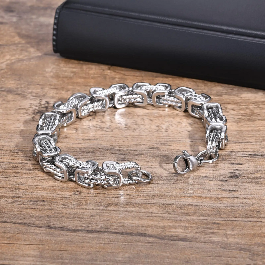 Stylish men's stainless steel bracelet. Polished chain design for a modern, sleek accessory.