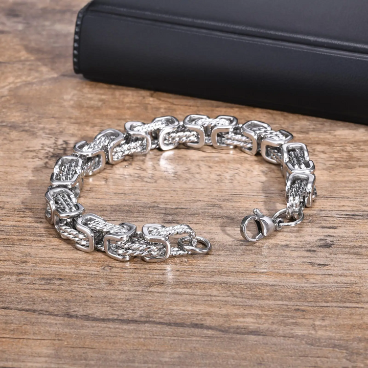 Stylish men's stainless steel bracelet. Polished chain design for a modern, sleek accessory.