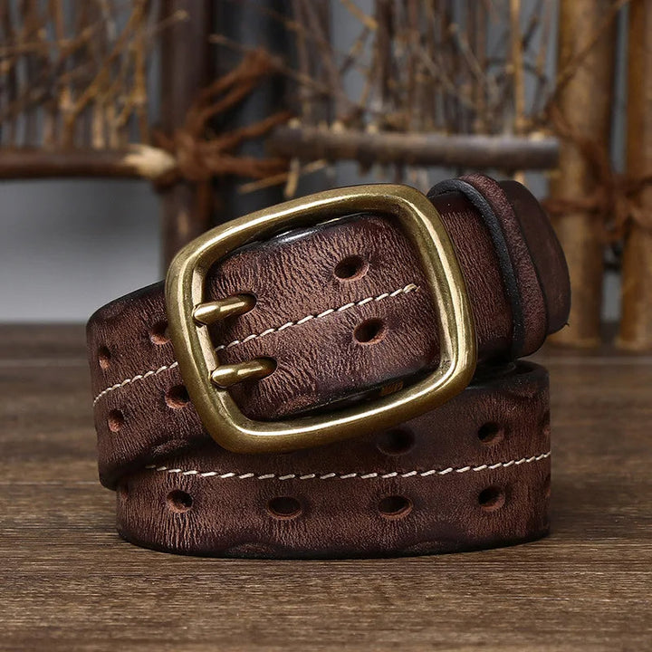 Close-up of a men's full-grain brown leather belt showing rich texture and sturdy solid brass buckle.