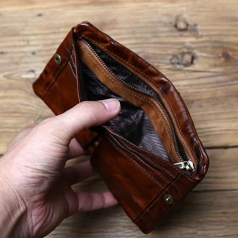 Front view of a black full-grain leather wallet for men, featuring a subtle texture and secure dual closure.