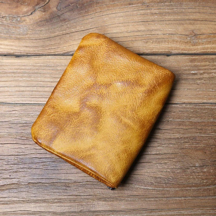 Hard-wearing full-grain leather men's wallet with robust dual closure. A durable, classic everyday carry item.