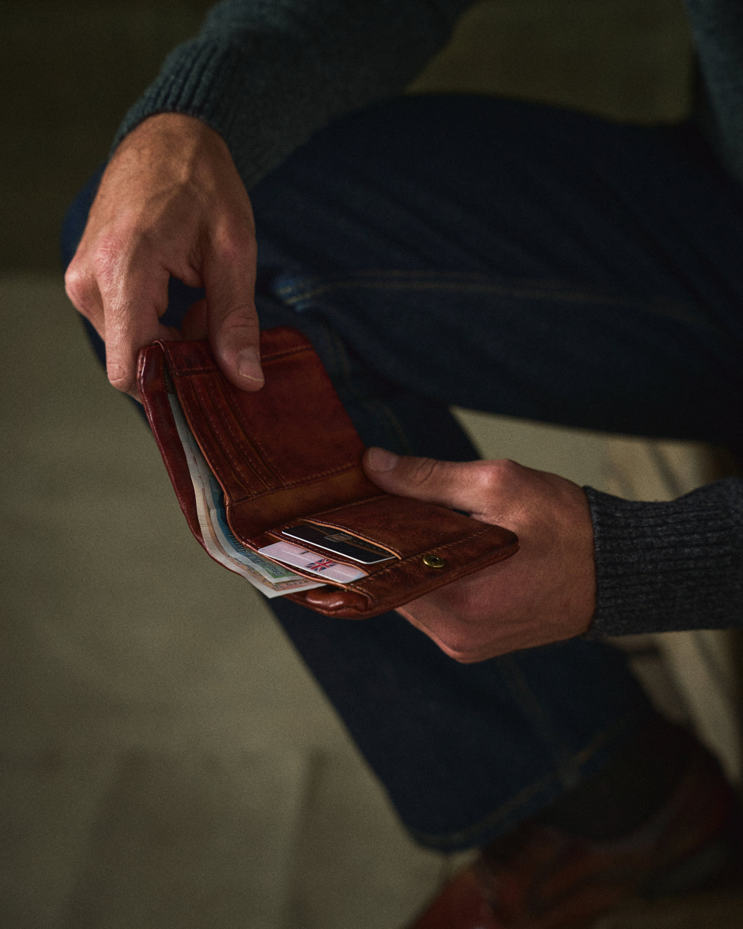 Closed classic black full-grain leather wallet for men with sleek dual closure. Durable design.