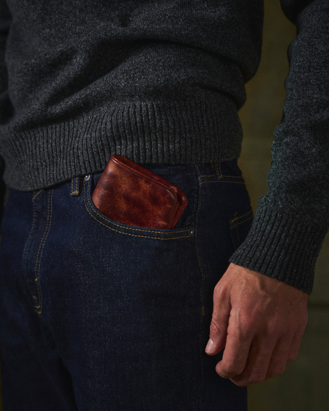 Close-up of rich, textured full-grain leather men's wallet, highlighting its durability and craftsmanship.