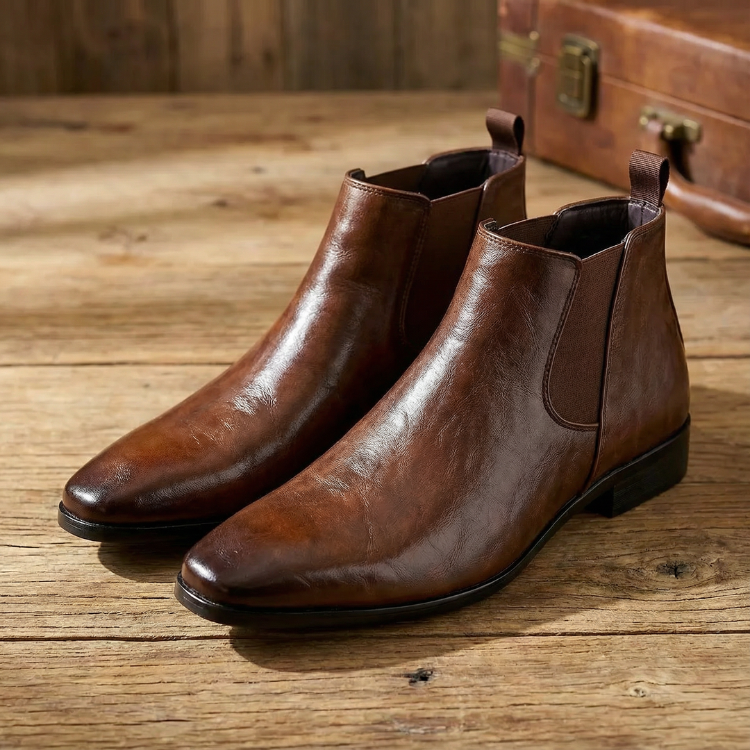 Brown full-grain leather Chelsea boots for men, a versatile slip-on style.