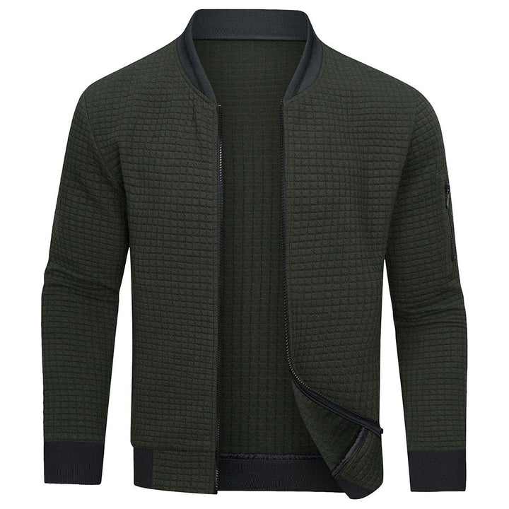 Close-up of a men's full-zip textured grid cardigan, highlighting the unique pattern and ribbed cuffs for fall.