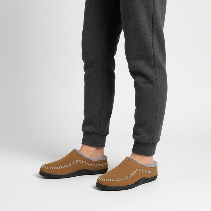 Close-up of men's gray fleece slippers, non-slip indoor shoes for loungewear