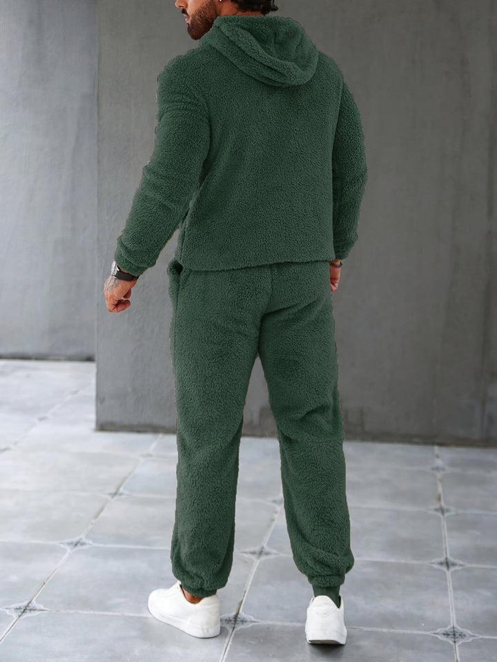 Black men's cozy fleece two-piece outfit with a warm hoodie and comfortable joggers for winter.