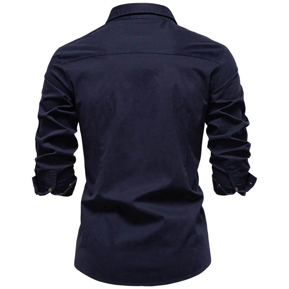 Man in full-length shot wearing a well-fitting Garrison utility shirt. Comfortable, long sleeve button-down.