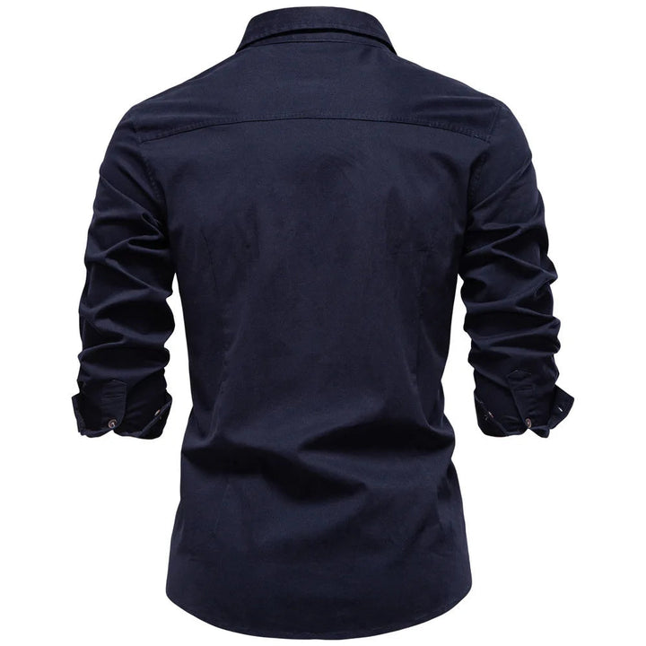 Man in full-length shot wearing a well-fitting Garrison utility shirt. Comfortable, long sleeve button-down.