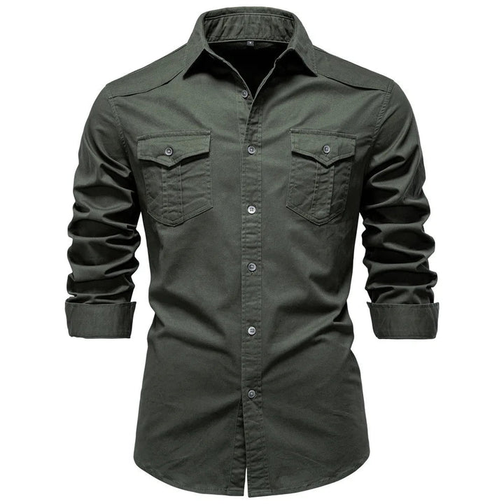 Man wearing a versatile Garrison utility shirt outdoors. Durable long sleeve button-down for active casual wear.