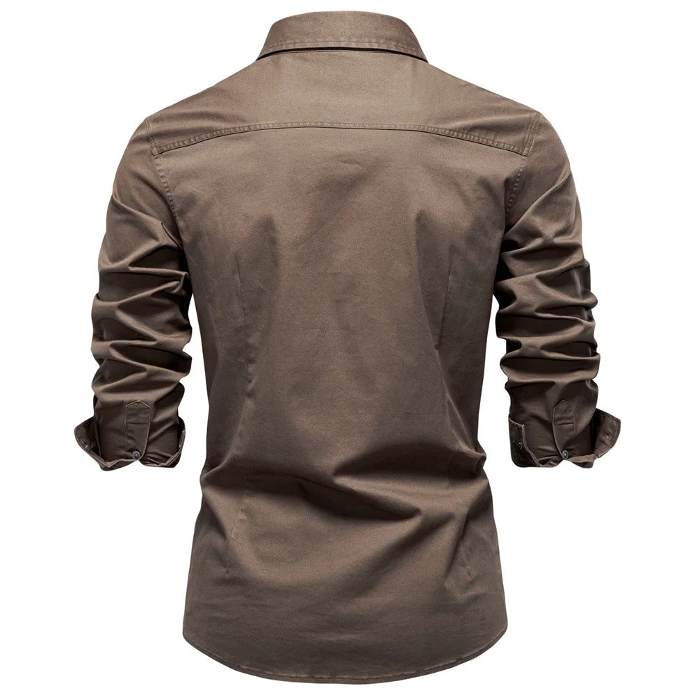 Men's Garrison utility shirt worn open over a t-shirt. Casual, versatile long sleeve button-down style.