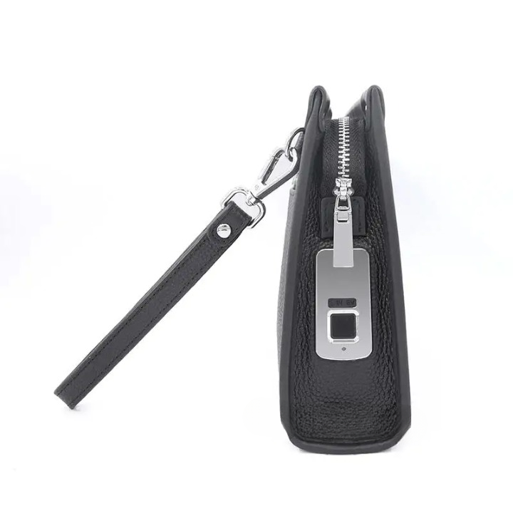 Man holding a sleek black genuine leather business clutch with visible fingerprint lock, showcasing its compact design.