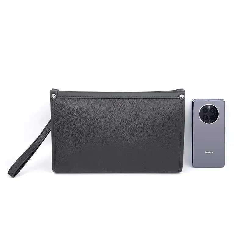 Close-up of fingerprint lock on a black genuine leather business clutch, security feature