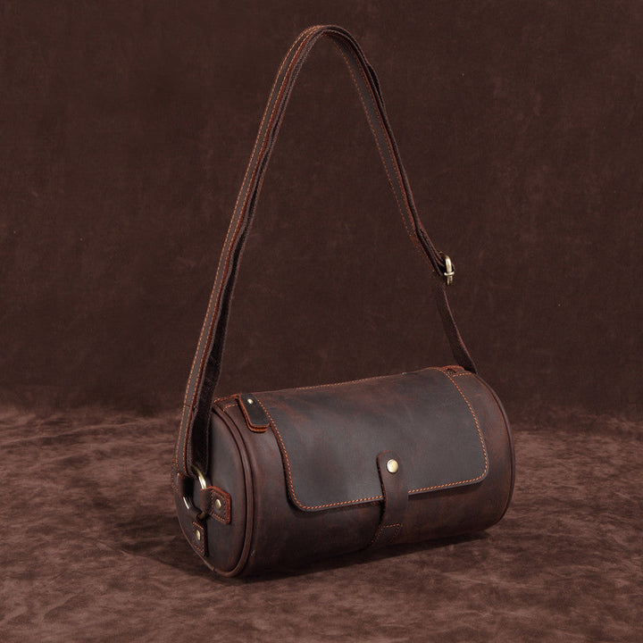 Men's leather messenger bag in an urban setting, a perfect genuine leather work & travel bag.