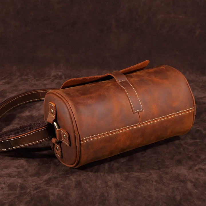 Spacious men's leather messenger bag, genuine & durable, perfect for laptops & travel essentials.