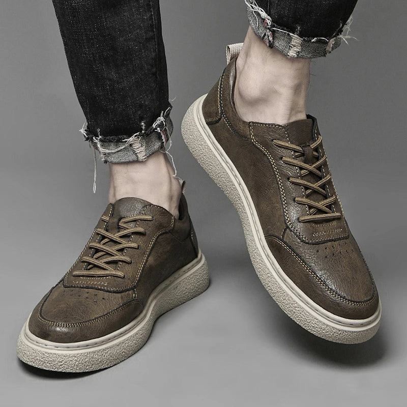 Durable rubber sole of men's genuine leather perforated sneakers, designed for everyday comfort and traction.