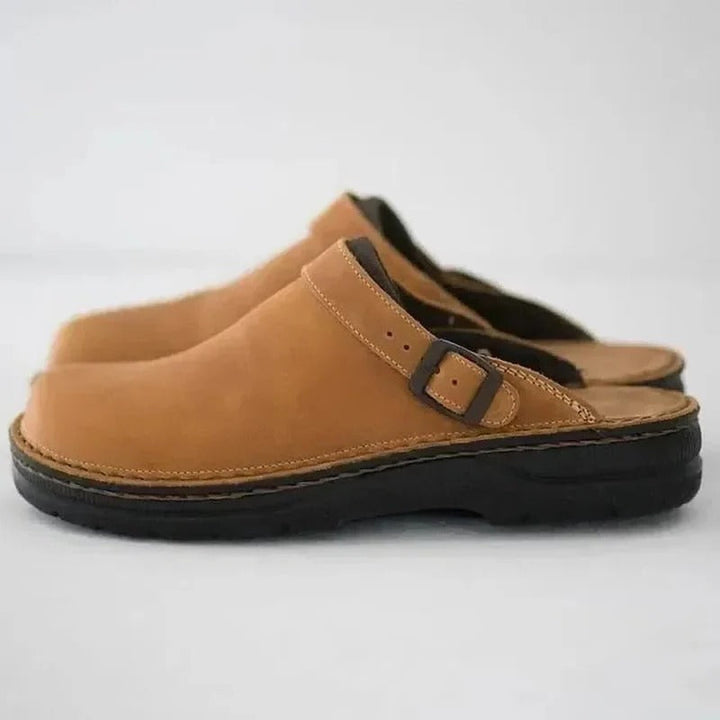 Stylish men's genuine leather slippers designed with orthotic comfort for ultimate arch support.