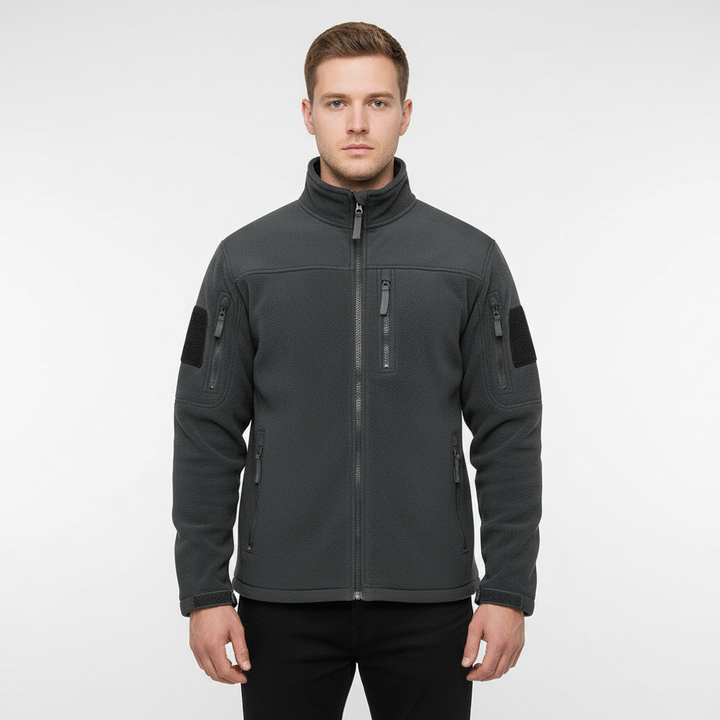 Men's Gero outdoor jacket in a natural setting, emphasizing its warm and protective qualities for winter