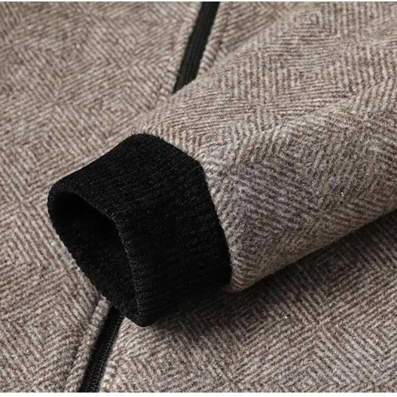 Close-up of men's Gianni tailored jacket, showing fine fabric detail. Sophisticated outerwear.