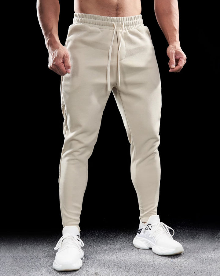 Premium men's Girona activewear joggers. Zip hems & tapered fit for versatile athletic and casual use.